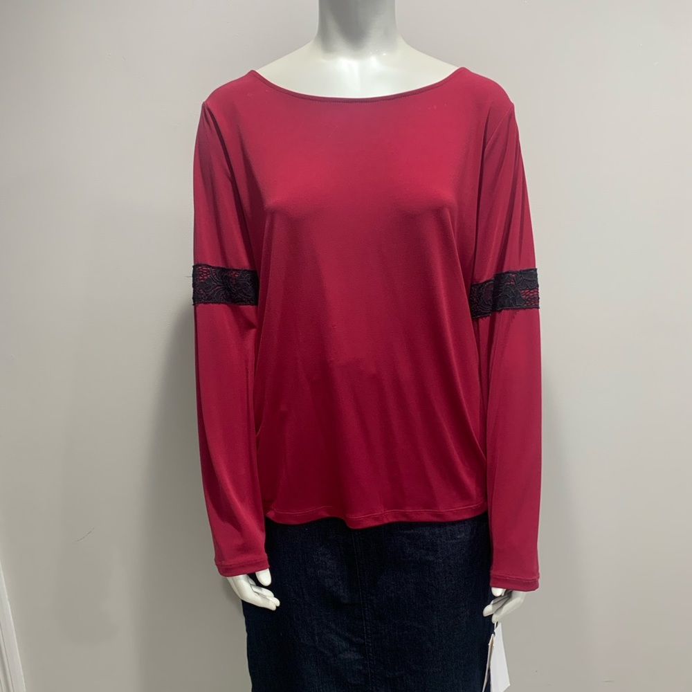 Red top with black lace accent on sleeve. Size XL